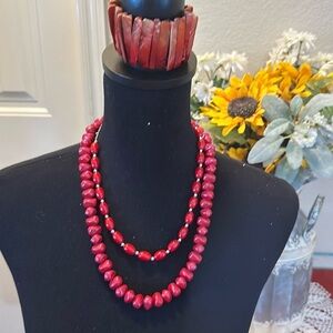 Two necklaces and a bracelet put together.